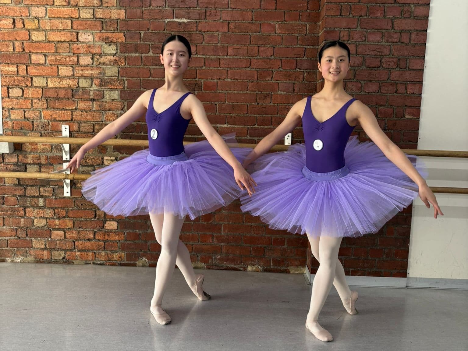 Two candidates in their examination tutus